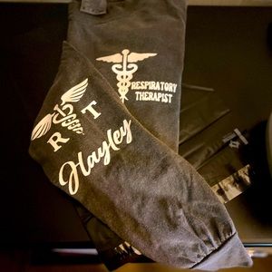 Respiratory Therapist with name on long sleeve shirt.